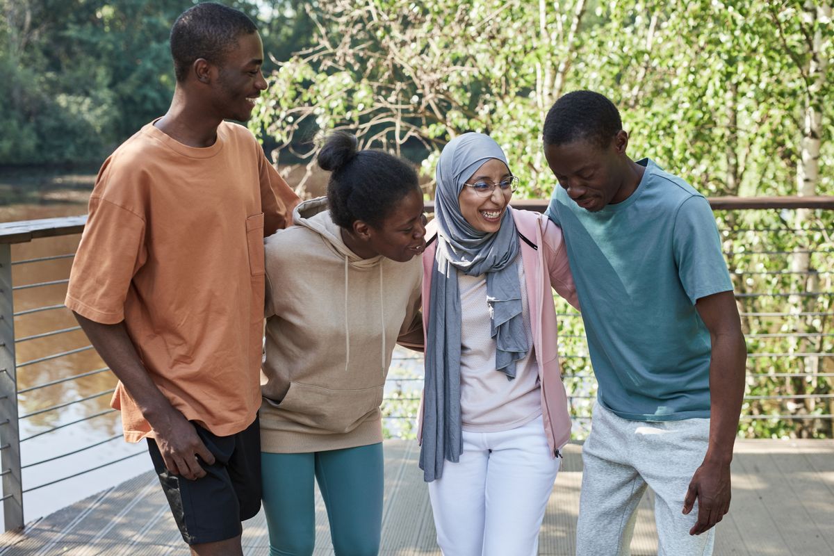 A diverse group of young people walking together outdoors.